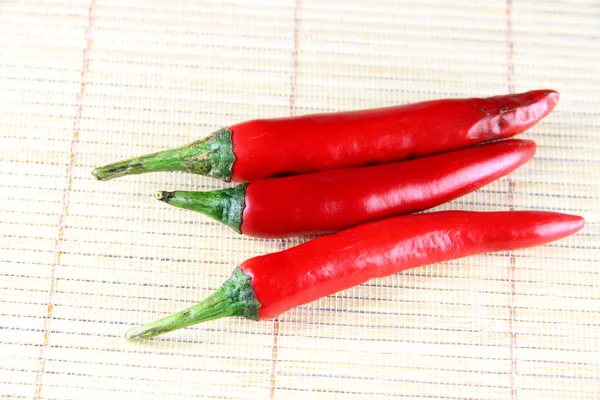 Red fresh paprika on bamboo background. — Stock Photo, Image