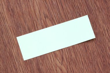 koyu renkli ahşap dikdörtgen mavi Not kağıt sıkışmış.