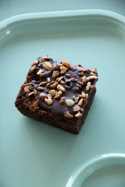 Bread of brownies on the green dish. — Stock Photo, Image