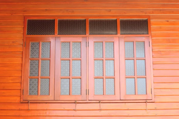 Windows on brown wooden wall in house. — Stock Photo, Image