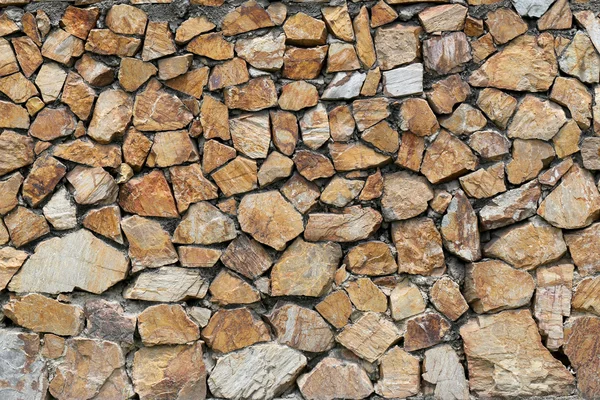 Muro di pietra marrone . — Foto Stock