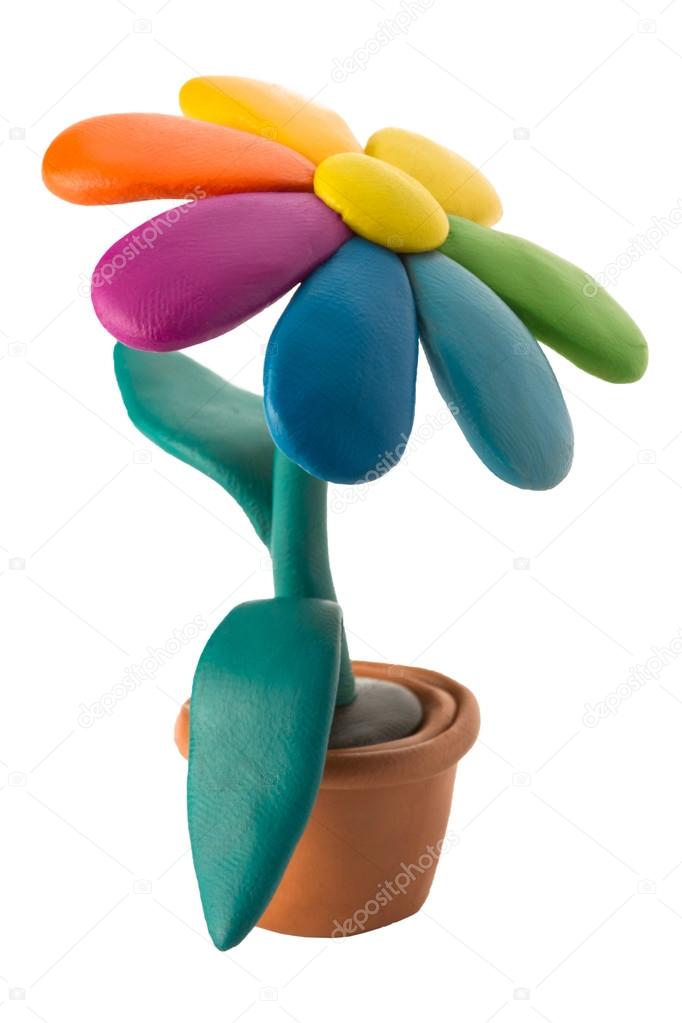 Plasticine colorful flower with leaves in brown pot