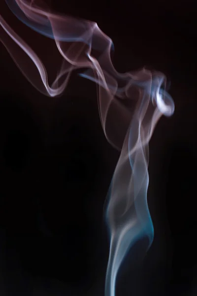 Dönen homojen bir arka plan üzerinde Tütsünün dumanı — Stok fotoğraf