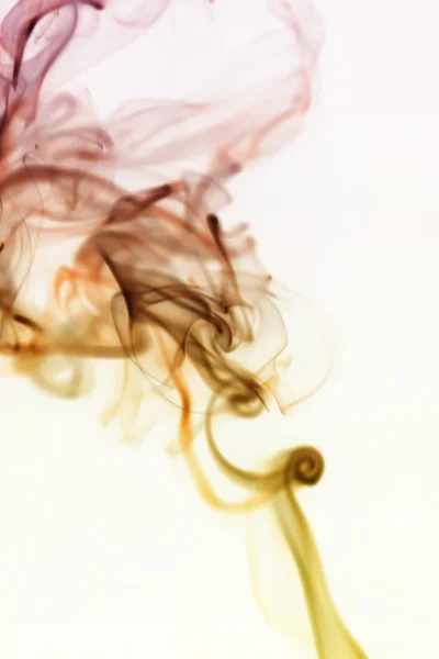 Swirling smoke from the incense on a homogeneous background — Stock Photo, Image