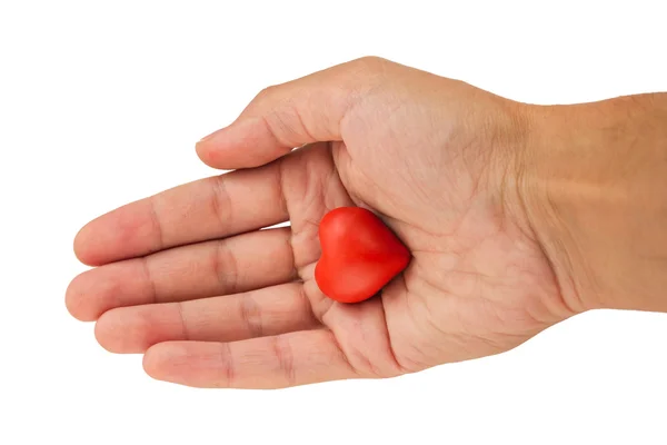 Cuore rosso fatto di plastilina in una mano su un backgrou bianco — Foto Stock