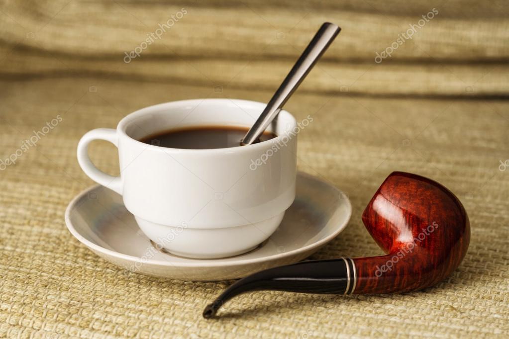 A cup of black coffee with a pipe in high resolution — Stock Photo