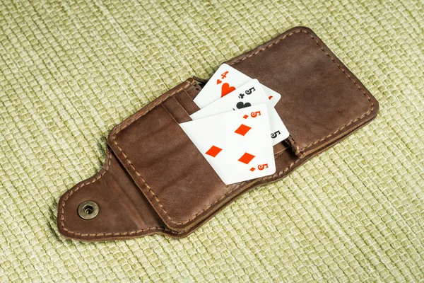 Purse made of leather and playing cards — Stock Photo, Image