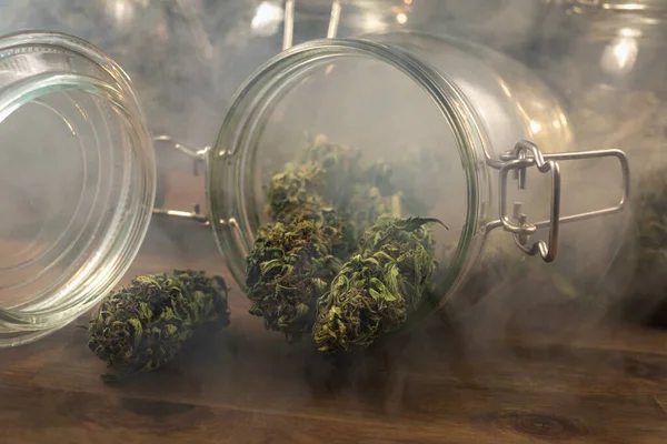 Cannabis buds in a cloud of smoke — Stock Photo, Image