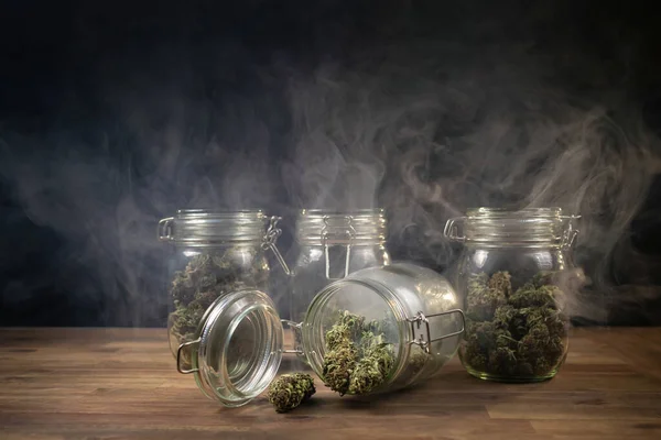 Storing cannabis buds in a glass jar — 图库照片