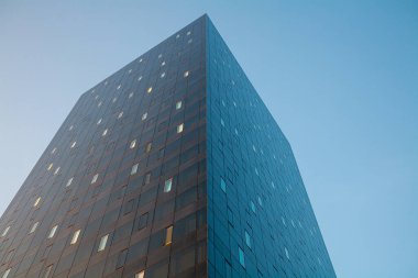 Glass skyscraper with sky