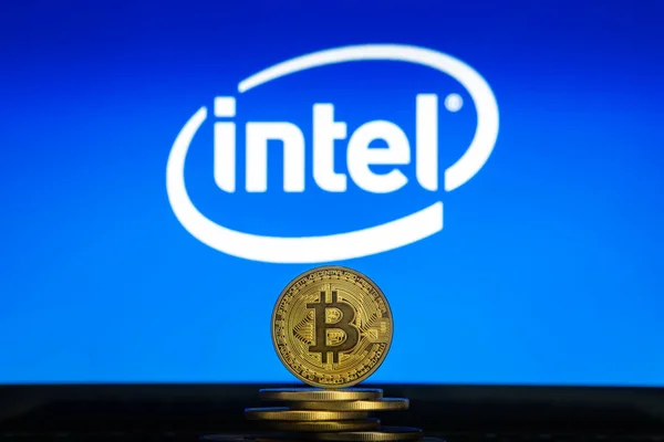 Intel logo on screen with Bitcoin coins — Stock Photo, Image