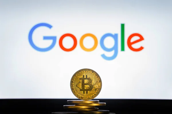 Google logo on screen with Bitcoin coins — Stock Photo, Image