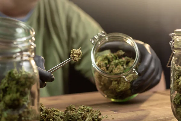 Weed buds in a glass jar — 图库照片