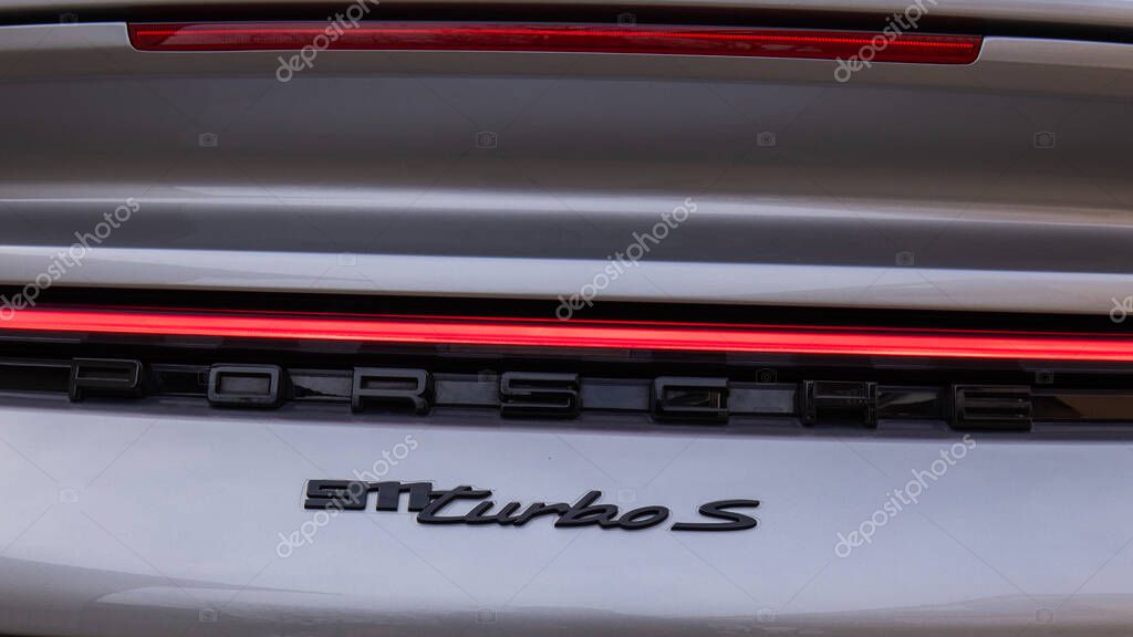 Slovenia, Ljubljana - March 15 2022: Porsche Logo Close up on a 911 Turbo S car