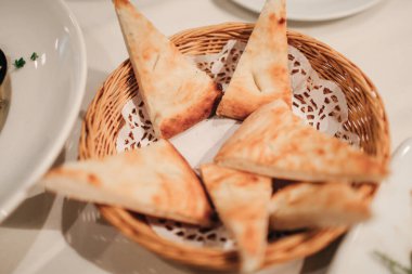 Bread eat with chopped fresh tomato, olive oil flavored with garlic for appetizer. Italian and French food. Dinner table concept.