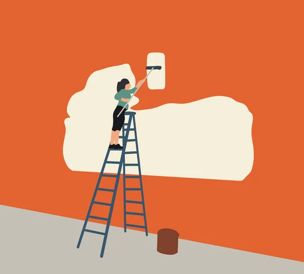 Woman standing on a ladder paint orange color to the wall using a paint-roller. Home decoration concept. Repair and house renovation.