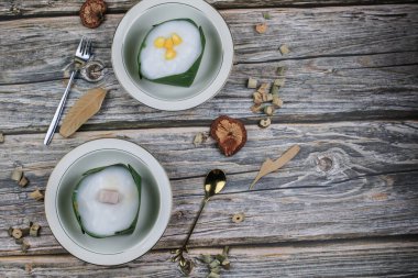 Thai Pudding with Coconut topping on banana leaf(Tako). Jelly coconut cream with corn and taro on top. Thai desert ,Famous