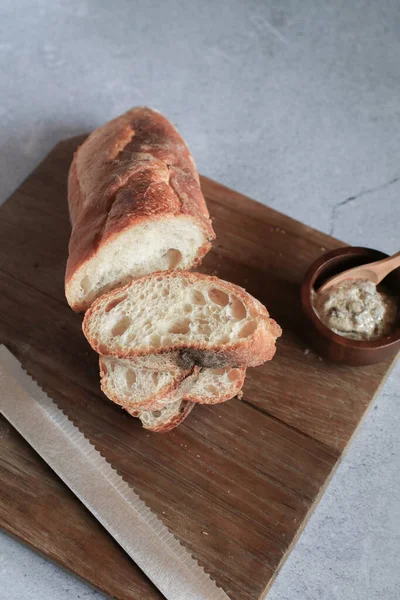 Baguette bread in package on gray background. Bread bun, French baguette. Tasty delicious crusty bread in bakery