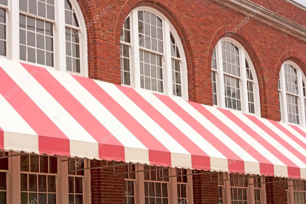 Brick Building With Striped Awning