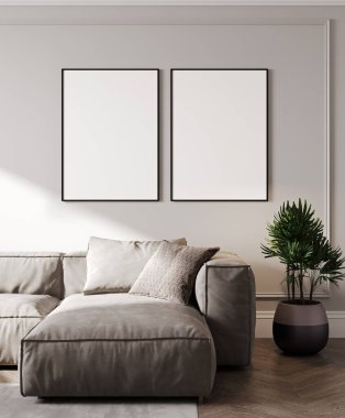 Boş iki çerçeve, modern oturma odasının iç kısmında gri kanepe ve palmiye yapraklarıyla, 3D işlemeli.