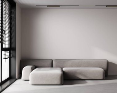 Gri kanepe ve boş bej duvarlı minimalist iç modelleme.