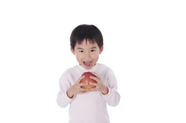 Schattige kleine jongen eten van een appel — Stockfoto