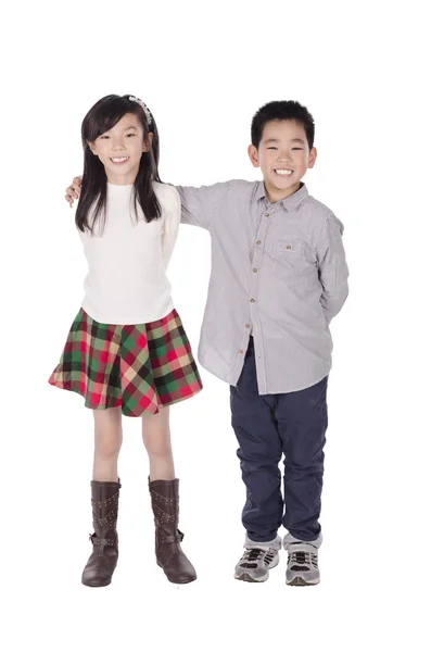 Brother bends his arm round his sister's shoulder — Stock Photo, Image