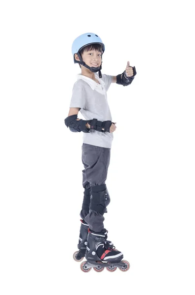 Slimme jongen spelen rollerblakes — Stockfoto