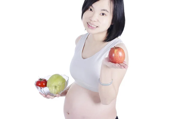 Mulher grávida com frutas frescas — Fotografia de Stock