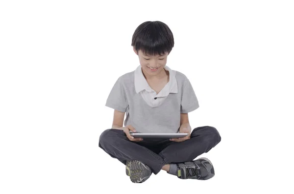 Niño con un touchpad — Foto de Stock