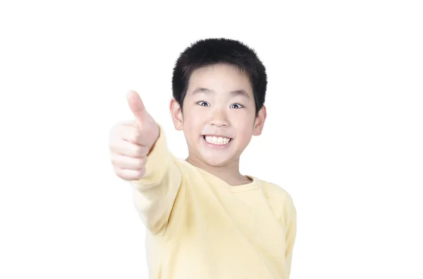 Alegre niño sosteniendo su pulgar hacia arriba — Foto de Stock