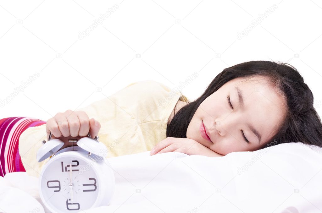 Sleeping girl with clock alarm