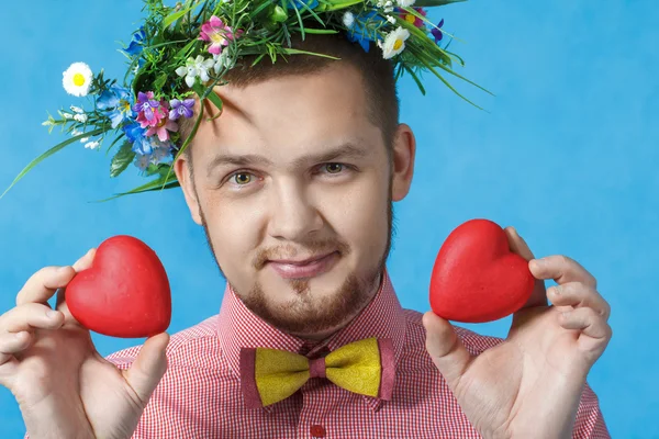 Valentine's day. Portrait of a man in love with two hearts — Stock Photo, Image