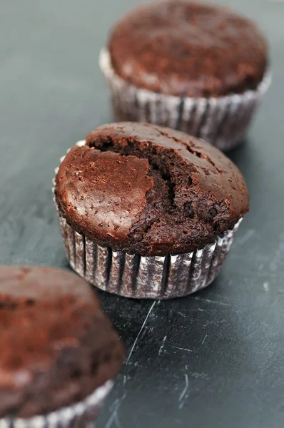 Sweet chocolate muffins on slate — Stock Photo, Image