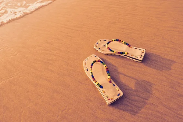 Sandals on the beach — Stock Photo, Image