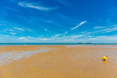 Beach walk on the beautiful Gold Beach off the coast of Ver-sur-Mer - Normandy - France