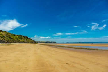Beach walk on the beautiful Gold Beach off the coast of Ver-sur-Mer - Normandy - France