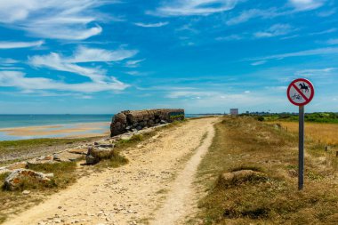 Beach walk on the beautiful Gold Beach off the coast of Ver-sur-Mer - Normandy - France