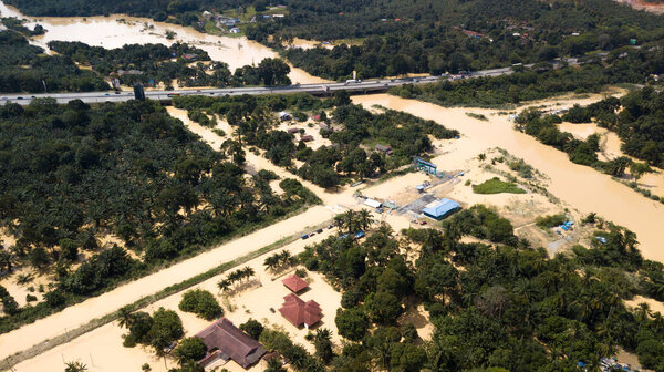 DENGKIL, MALAYSIA - DEC 20, 2021: Areal view of Dengkil district from flooding that causes damage of the infrastructure and housing area. Selective focus, contains dust and grain
