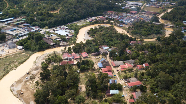 HULU LANGAT, MALAYSIA - DEC 22, 2021: Flood situation at Hulu Langat district that causes damage of the infrastructure and housing area. Selective focus, contains dust and grain