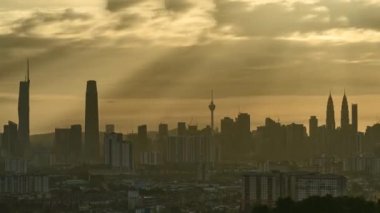 KUALA LUMPUR, MALAYSIA - July 9, 2022: Timelapse 4k UHD footage of cityscape of Kuala Lumpur and moving cloud and sunset