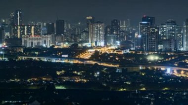 Kuala Lumpur, Malaysia - Jun 27, 2022 - Timelapse 4k UHD footage of cityscape of Kuala Lumpur at night and moving car time-lapse