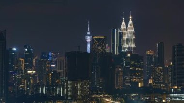 Kuala Lumpur, Malaysia - July 23, 2022 - Timelapse 4k UHD footage of cityscape of Kuala Lumpur at night and city light time-lapse
