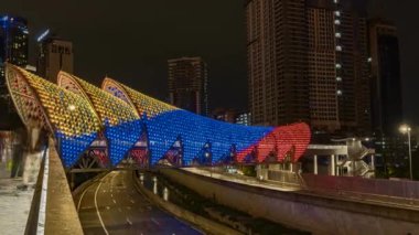KUALA LUMPUR, MALAYSIA, FEBRUARY 9 2020 : Time-lapse footage of a pedestrian bridge named Lintasan Saloma near Kuala Lumpur Petronas Twin Tower (KLCC).