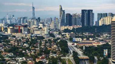 Kuala Lumpur, Malaysia - August 7, 2022 - Timelapse 4k UHD footage of cityscape of Kuala Lumpur from dawn until night, car moving and city light