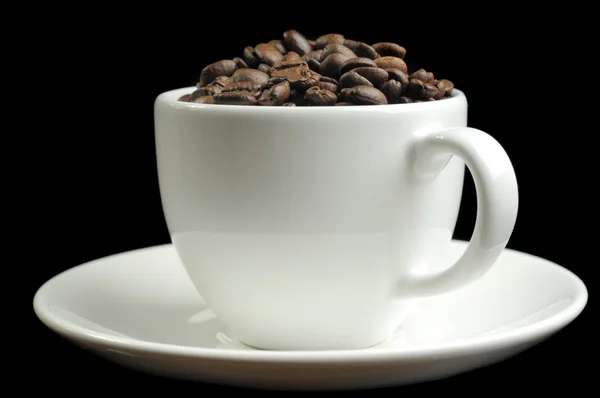 Cup full of coffee beans Stock Picture