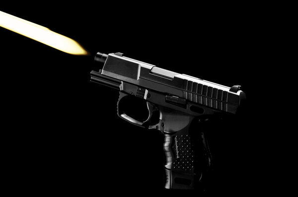 The black gun isolated on black background