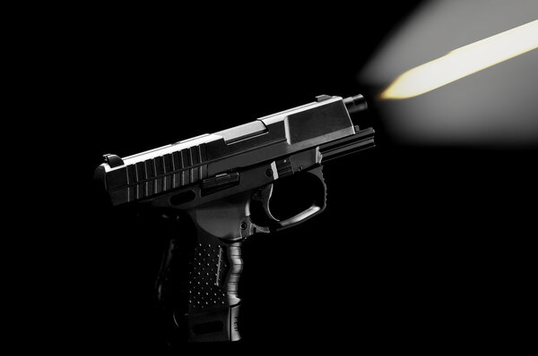 The black gun isolated on black background