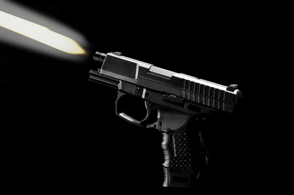 The black gun isolated on black background