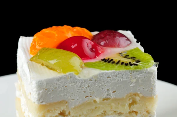 A dessert cake isolated on black background — Stock Photo, Image